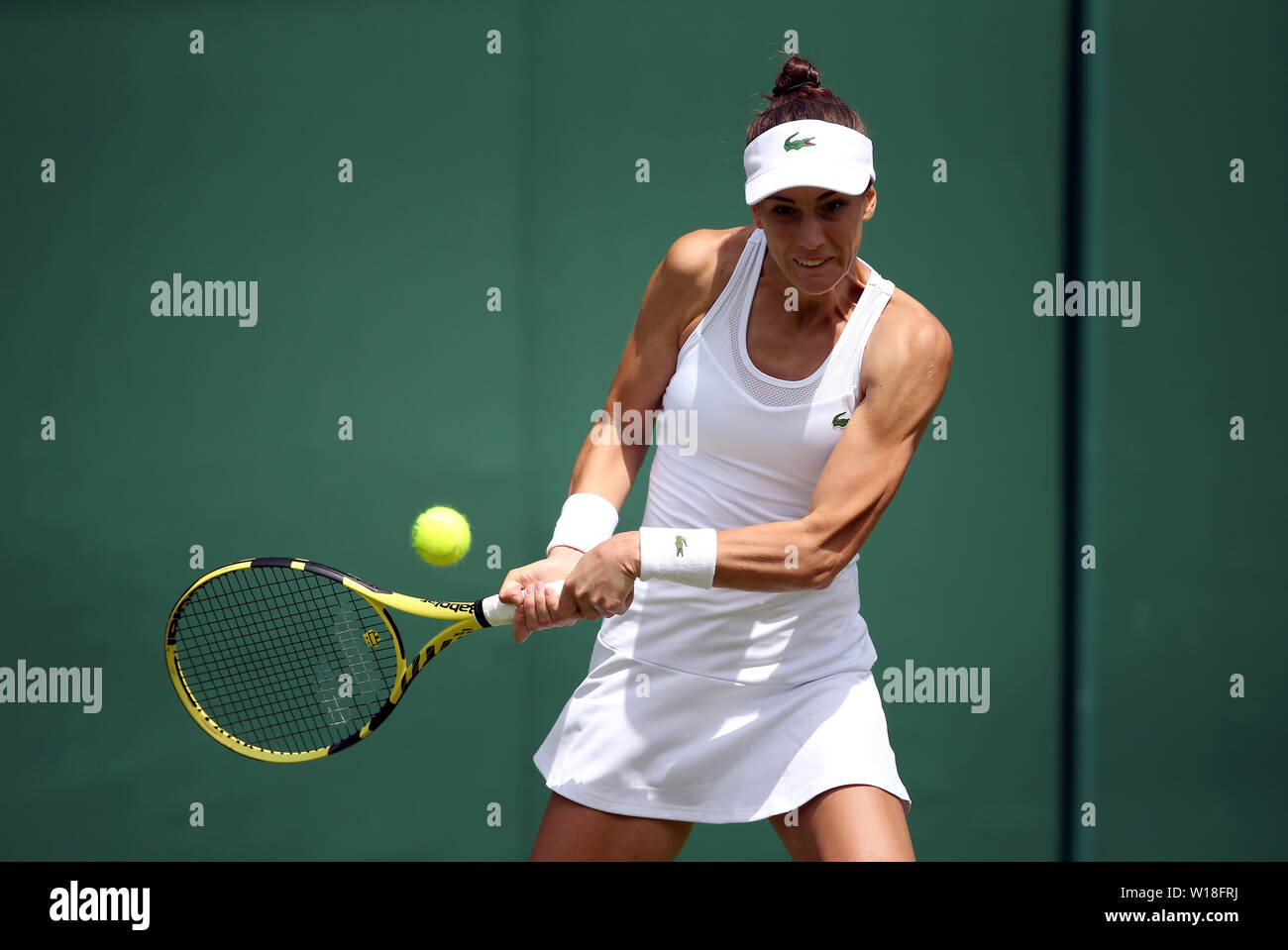 Bernarda Pera in action on day one Wimbledon Championships at the All England Lawn Tennis and Croquet Club, Wimbledon Stock Photo - Alamy
