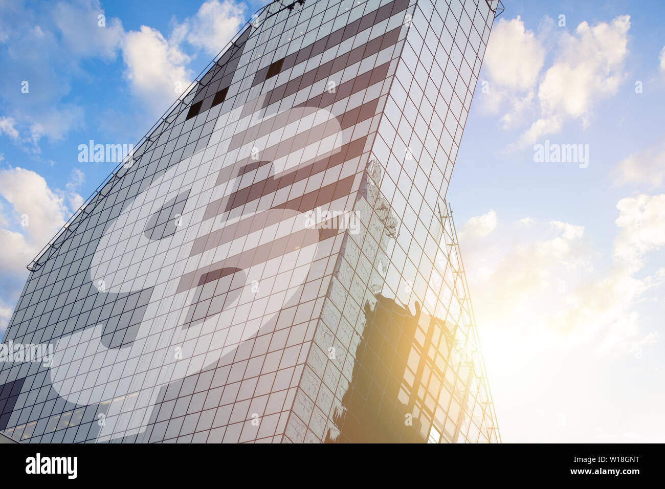 Modern office building with sign dollar on a background of the blue sky ...