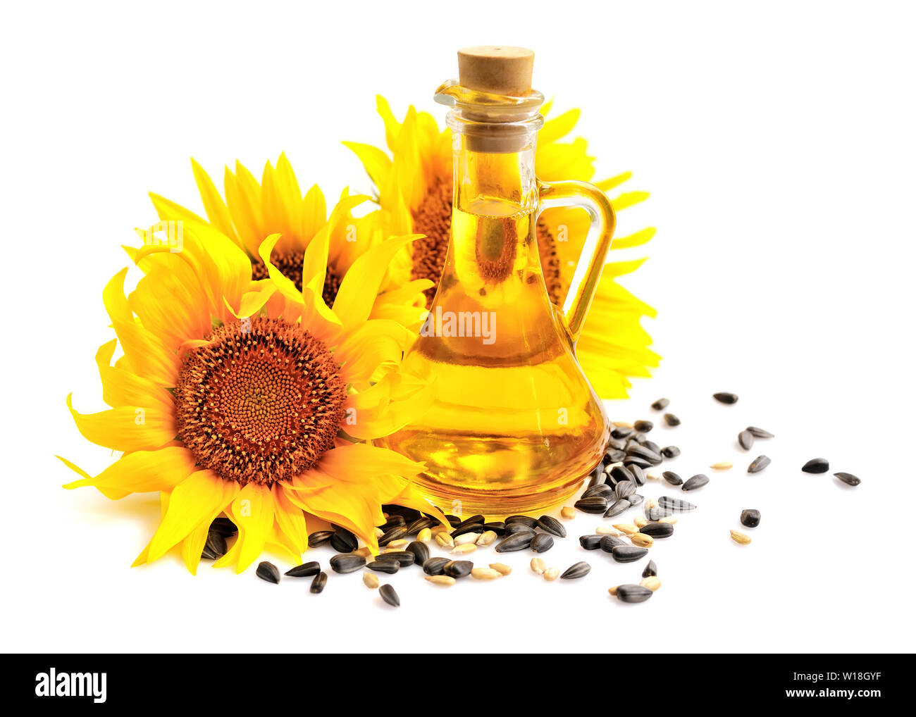 Sunflower oil with flowers and by seed on white background Stock Photo