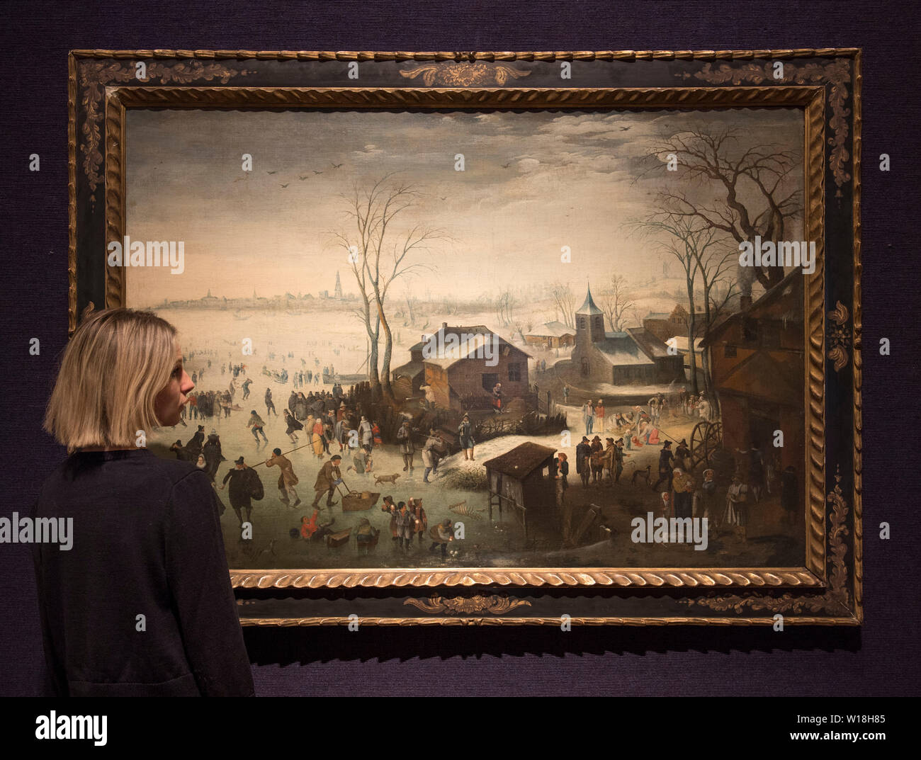 Bonhams, London, UK. 1st July 2019. Works by Brueghel, Constable and de Ribera on display in the Old Masters sales preview, to be sold on 3 July 2019. Image: Attributed to Jan Wildens, Winter: a landscape with elegant figures skating and boys fighting with snowballs in the foreground, and a view of Antwerp in the distance. Estimate £55,000-75,000. Credit: Malcolm Park/Alamy Live News. Stock Photo