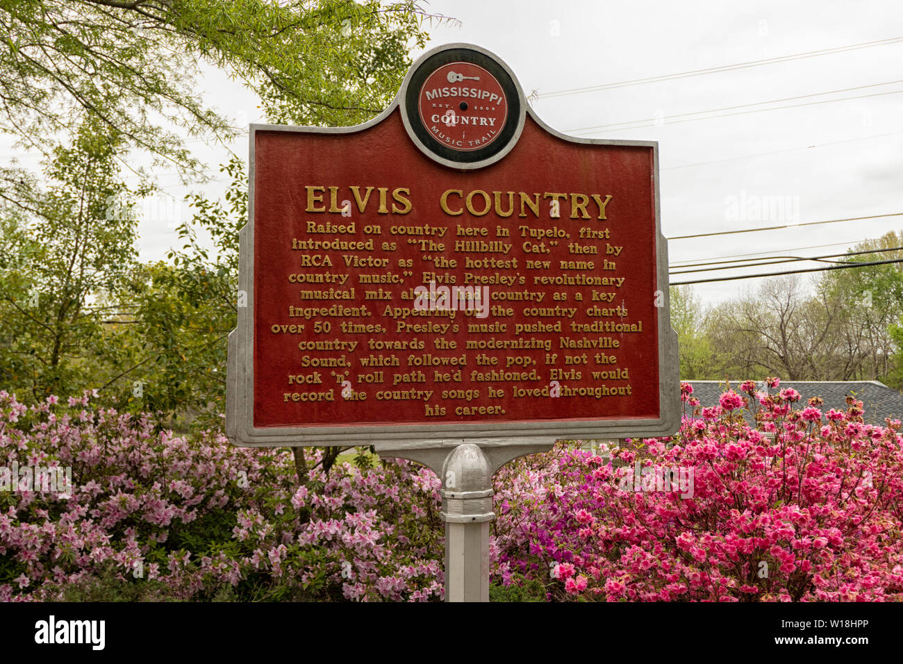 Red and Gold historic placard on the grounds of Elvis Birthplace Museum in Tupelo MS Stock Photo