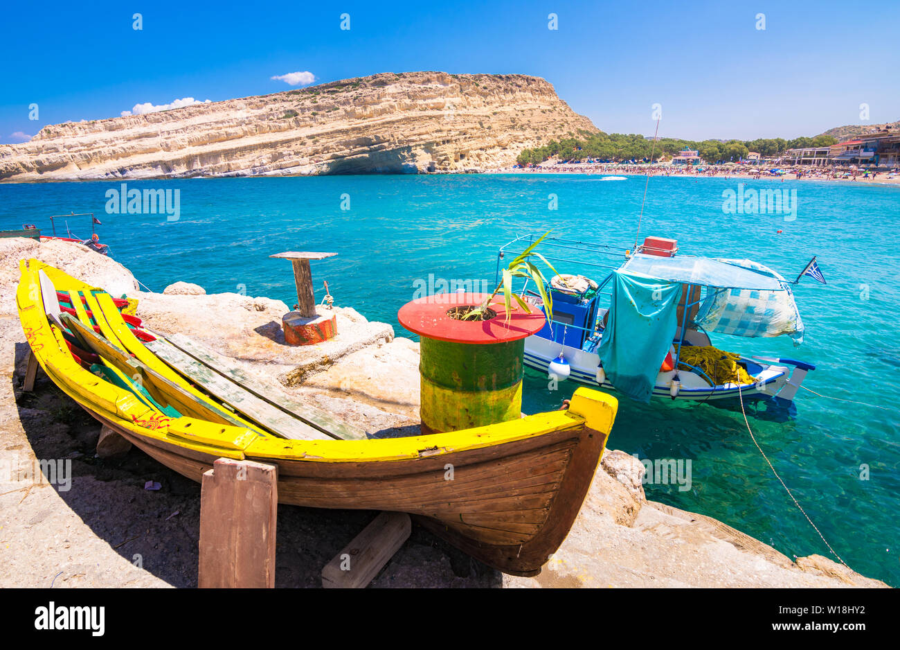 Matala beach with caves on the rocks that were used as a roman cemetery and at the decade of 70's were living hippies, Crete, Greece. Stock Photo