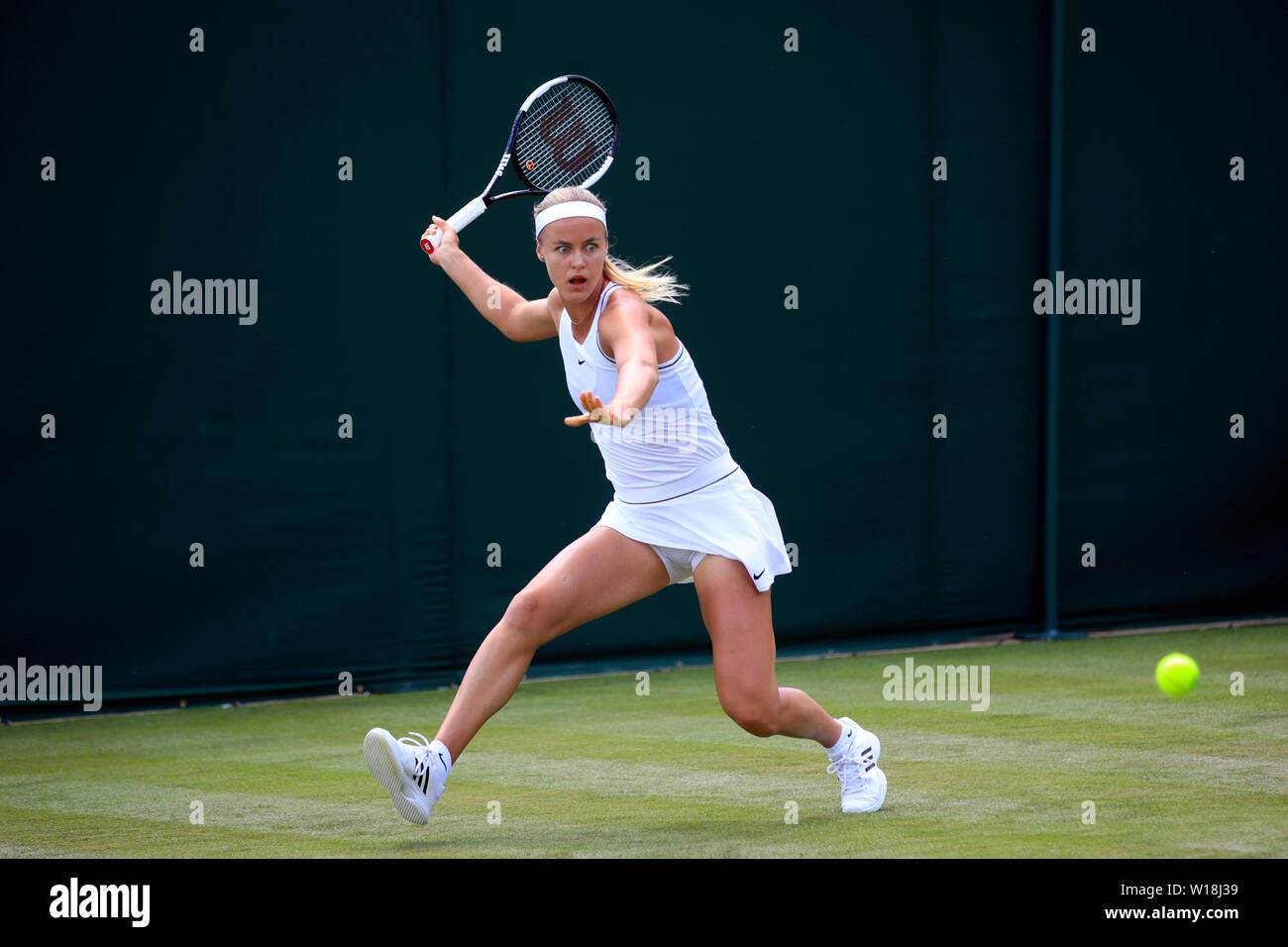 Anna Karolina Schmiedlova in action on day one of the Wimbledon