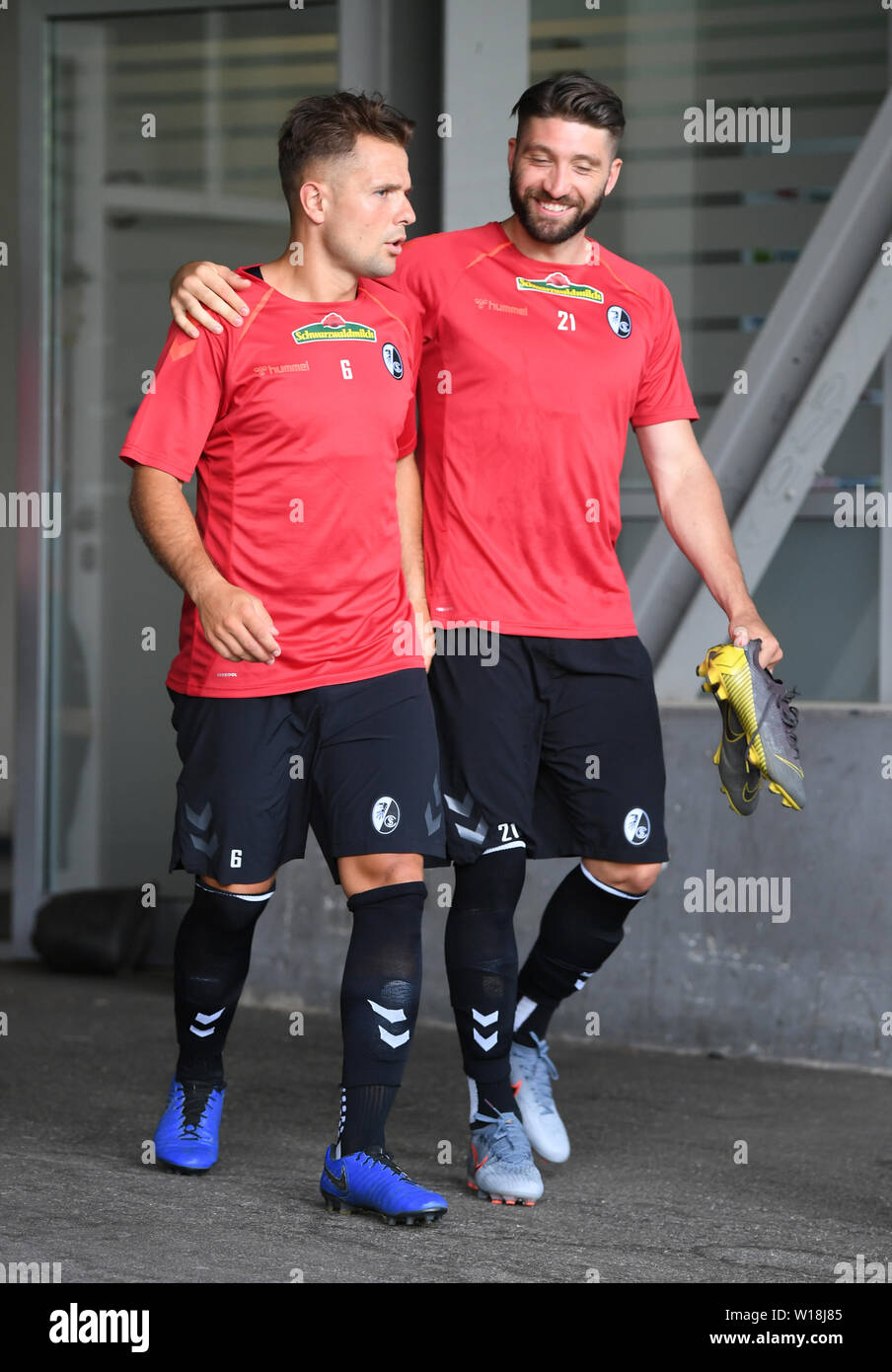 01 July 2019, Baden-Wuerttemberg, Freiburg: Soccer: Bundesliga, training kick-off SC Freiburg, Amir Abrashi (l) and Brandon Borrello (r) come out of the cabin. Photo: Patrick Seeger/dpa Stock Photo