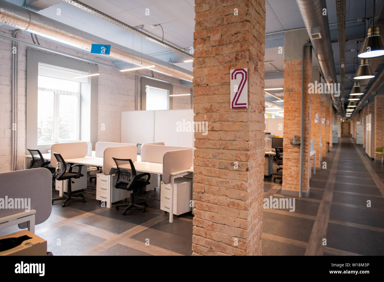 Interior Of Modern Loft Office Open Space With Desks And