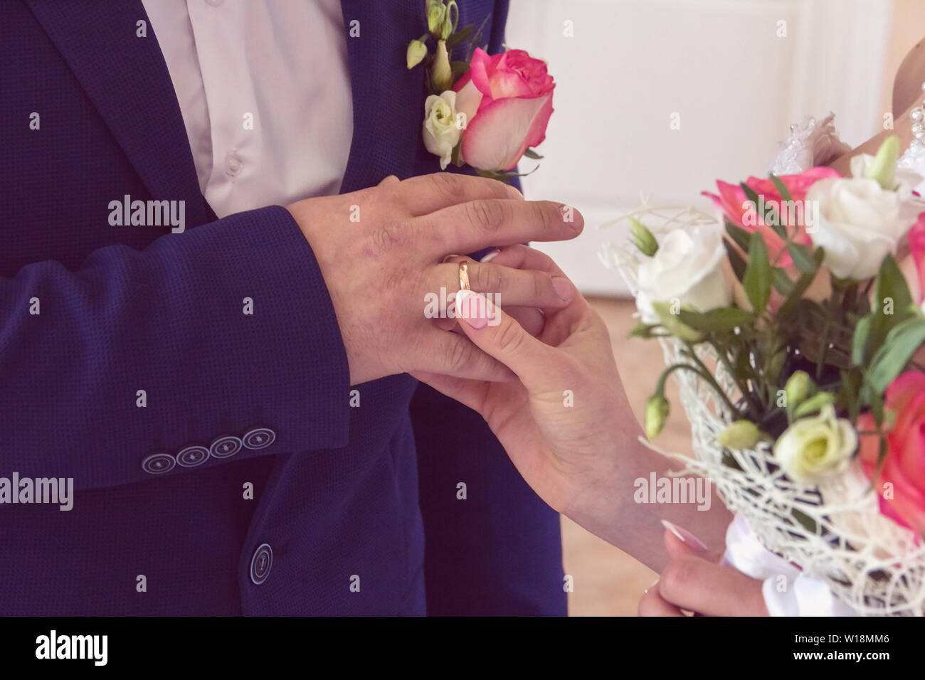 Wedding ceremony of the bride and groom. The bride wears a wedding ring ...