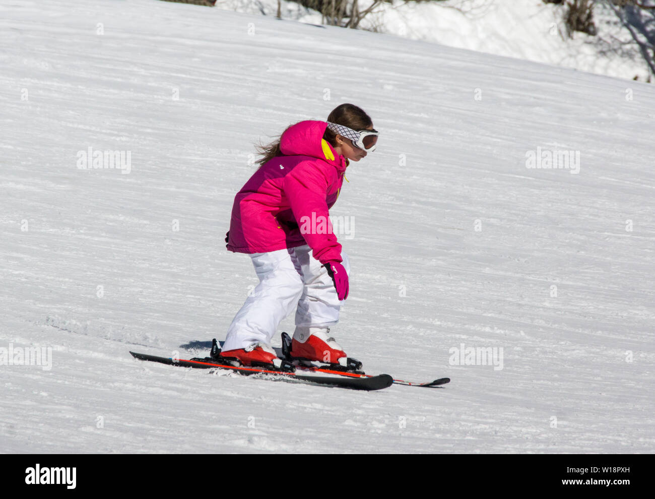 The central Pyrenees at Pont Espagne. Young boy learning to ski on the beginners slope.No sticks. Stock Photo