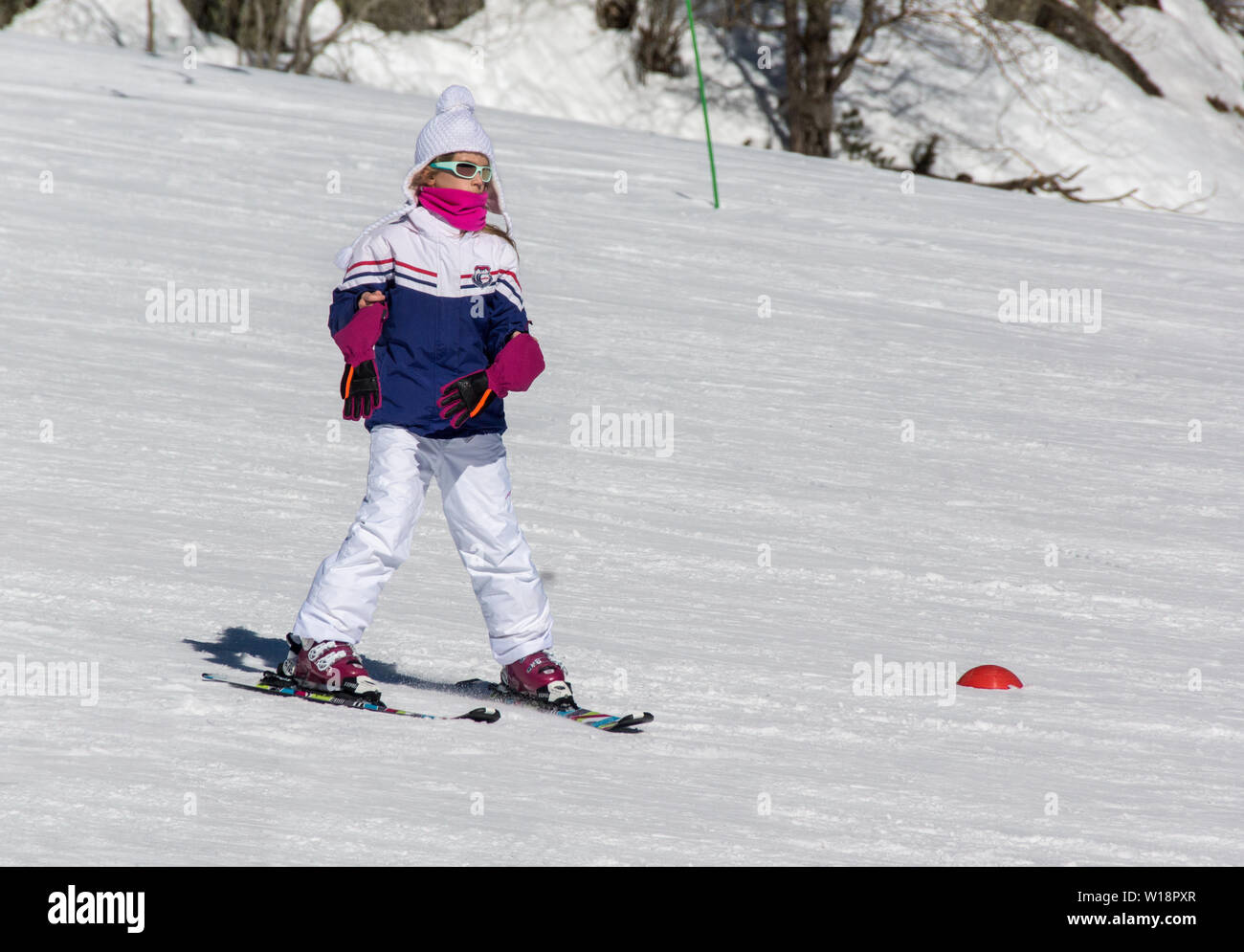 The central Pyrenees at Pont Espagne. Young girl learning to ski.No sticks. Stock Photo