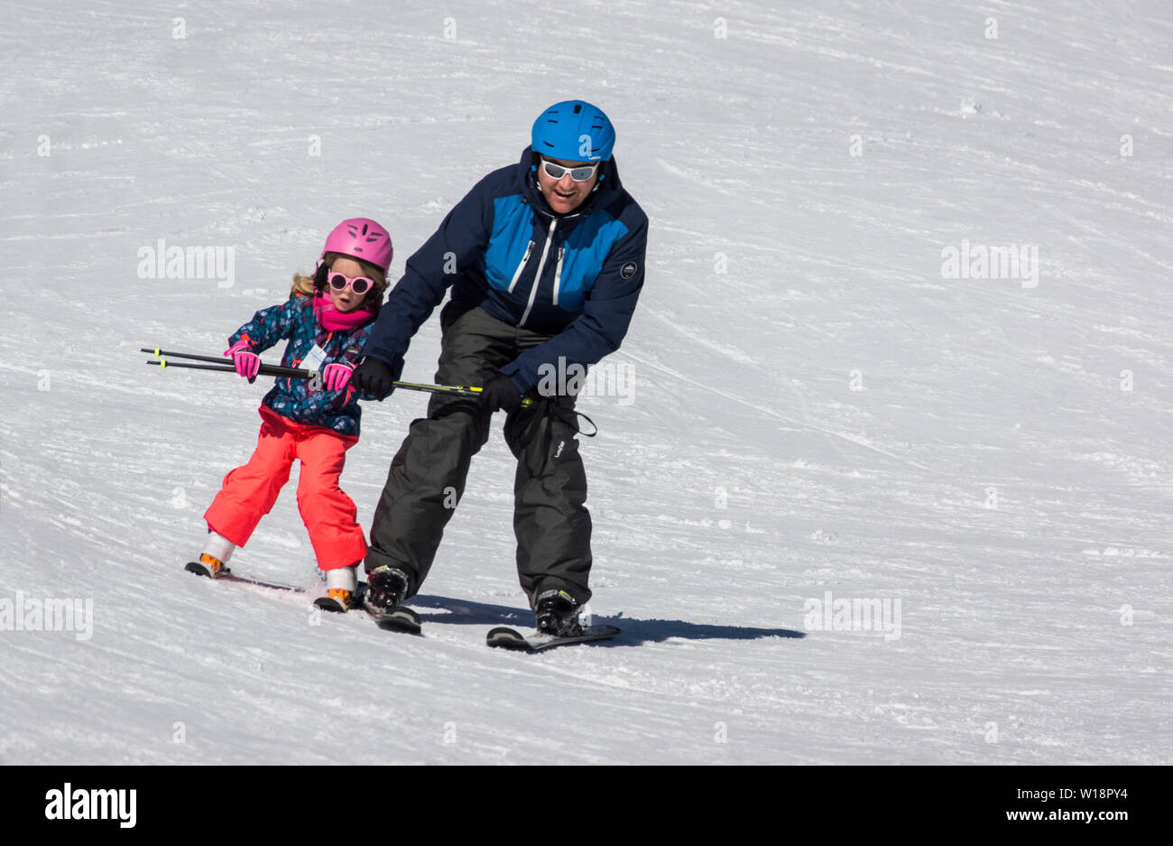 France. Pont Espagne. Father teaching his daughter to ski Stock Photo