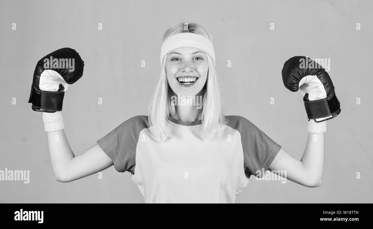 Woman boxing gloves enjoy workout. Woman exercising with boxing gloves