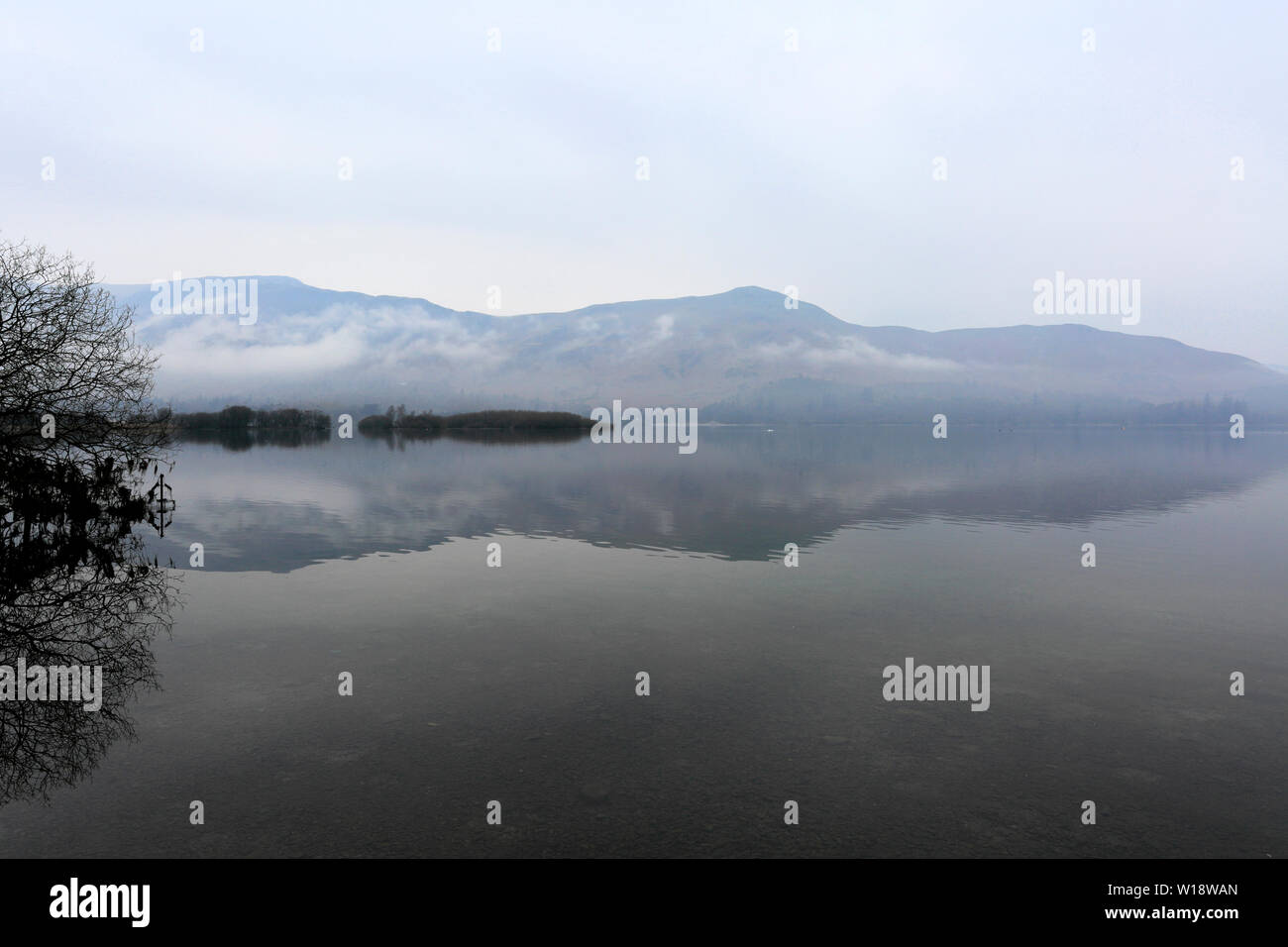Mist over Derwentwater lake, Keswick town, Lake District National Park, Cumbria, England, UK Stock Photo