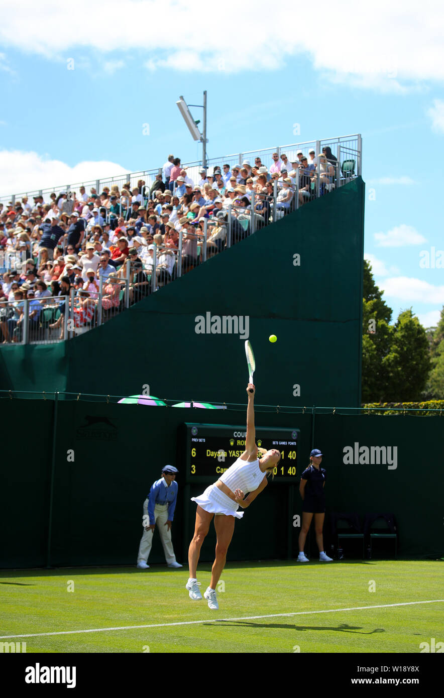Camila Giorgi in action on day one of the Wimbledon Championships at the All England Lawn Tennis and Croquet Club, London. Stock Photo