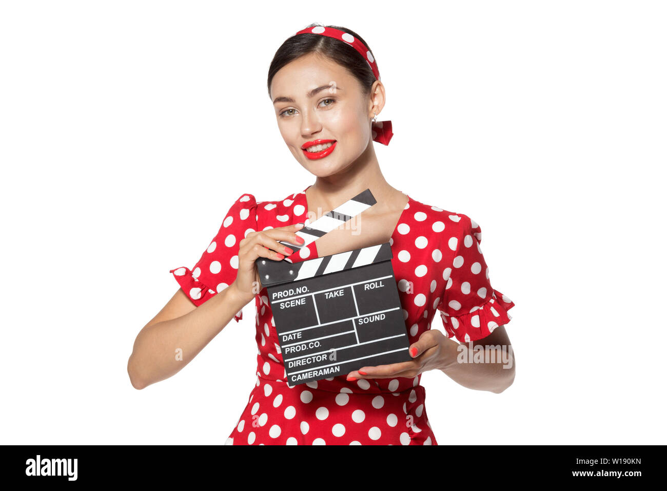 Woman with movie clapper board. Young retro pin-up girl Stock Photo