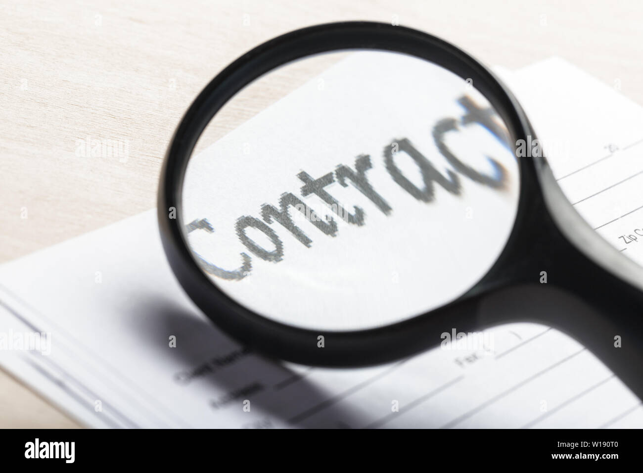 Magnifying Glass and document close up Stock Photo