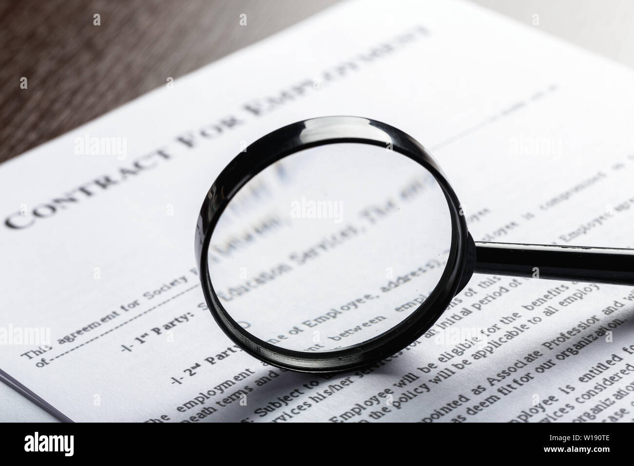 Magnifying Glass and document close up Stock Photo