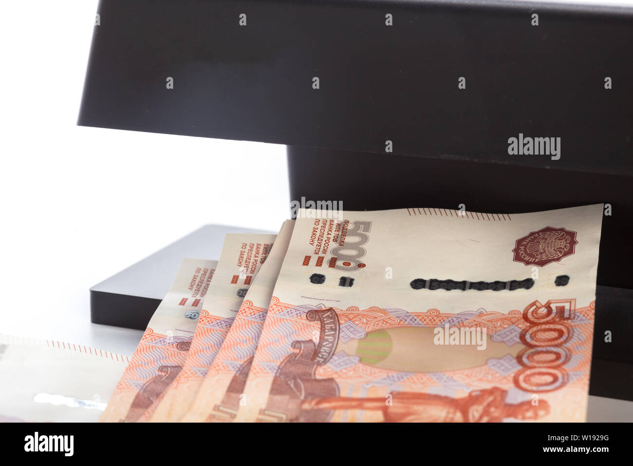 money checker isolated on white Stock Photo - Alamy