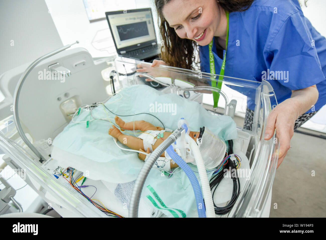 London, UK.  1 July 2019.  A researcher from University of London Hospital, with a model of a baby, demonstrates how new light based technology can be used to monitor the brain activity of new born babies in neo-natal intensive care units. Preview of the annual Summer Science Exhibition at the Royal Society.  22 exhibits showing some of the latest and most innovative research in science, engineering and technology from across the UK is presented to the public 1 July to 7 July 2019. Credit: Stephen Chung / Alamy Live News Stock Photo