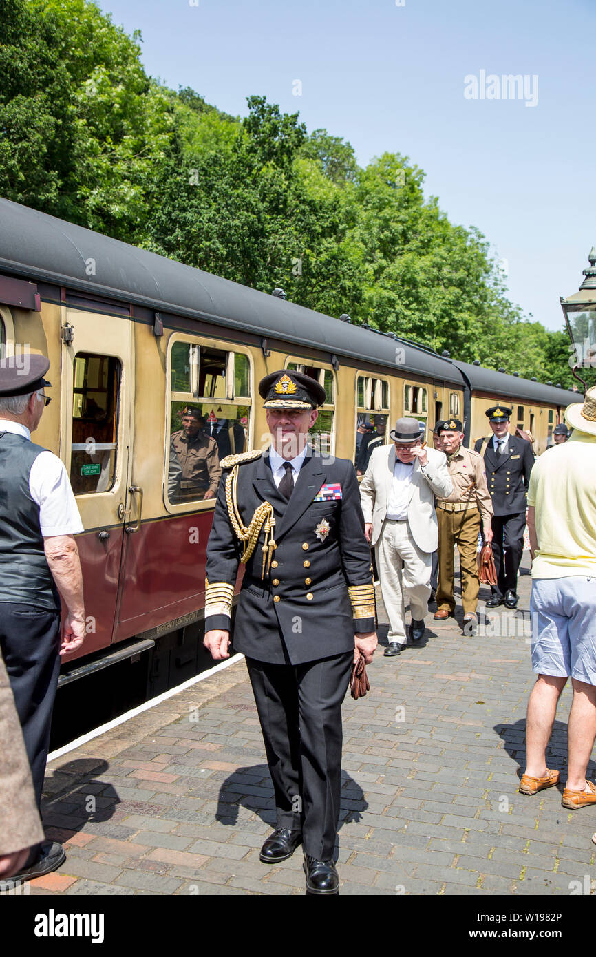Kidderminster, UK. 29th June, 2019. Severn Valley Railways 'Step back to the 1940's' gets off to a fabulous start this weekend with costumed re-enactors playing their part in providing an authentic recreation of wartime Britain. A convincing King George VI lookalike, heading the VIP party, ensures that visitors are successfully transported back in time as they watch his majesty escorted around the region. Credit: Lee Hudson Stock Photo