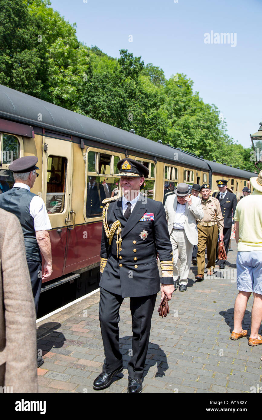 Kidderminster, UK. 29th June, 2019. Severn Valley Railways 'Step back to the 1940's' gets off to a fabulous start this weekend with costumed re-enactors playing their part in providing an authentic recreation of wartime Britain. A convincing King George VI lookalike, heading the VIP party, ensures that visitors are successfully transported back in time as they watch his majesty escorted around the region. Credit: Lee Hudson Stock Photo