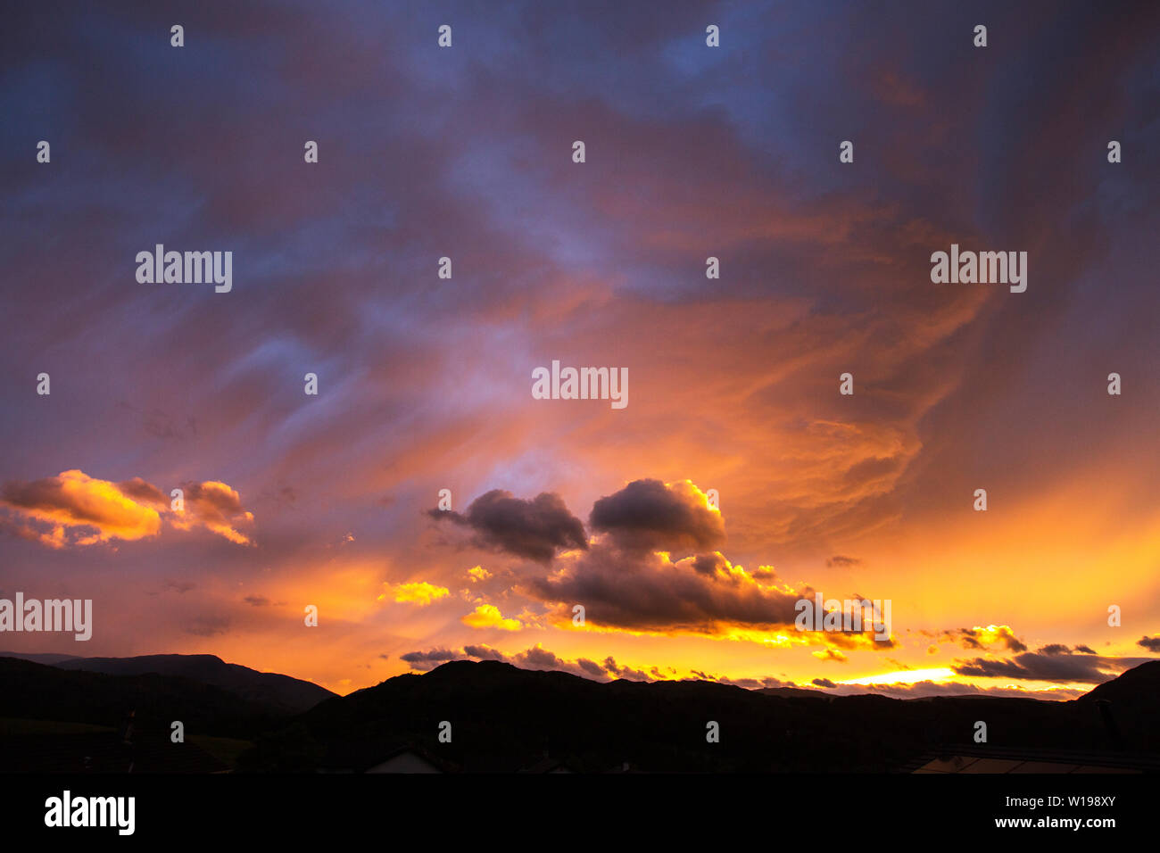 Clouds at sunset over Ambleside during stormy weather, Lake District, UK Stock Photo Alamy