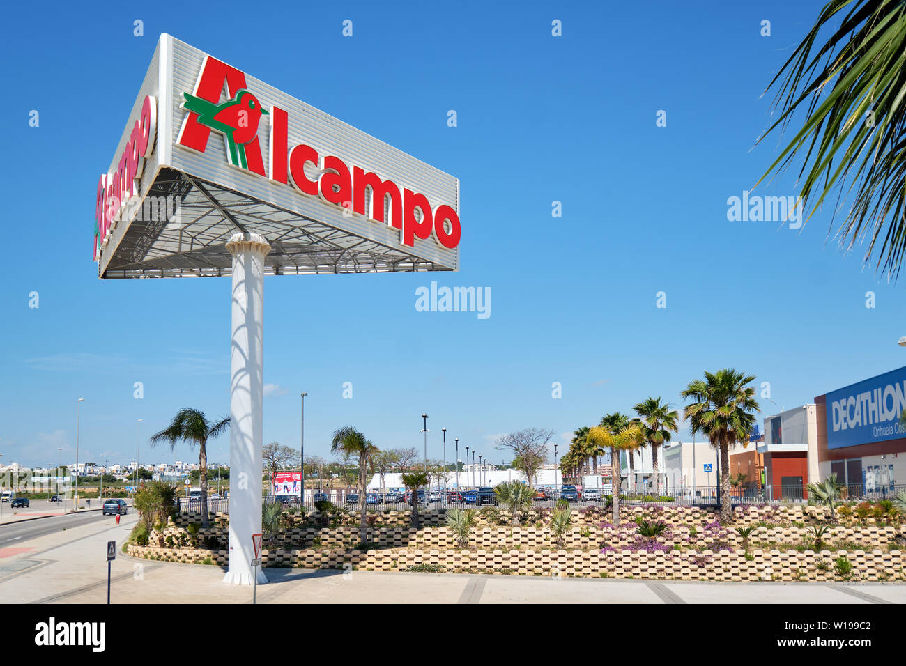 Torrevieja, Spain- May 1, 2019: Huge Alcampo signboard near shopping mall La Zenia. Alcampo (Auchan) is a French global retail group Stock Photo