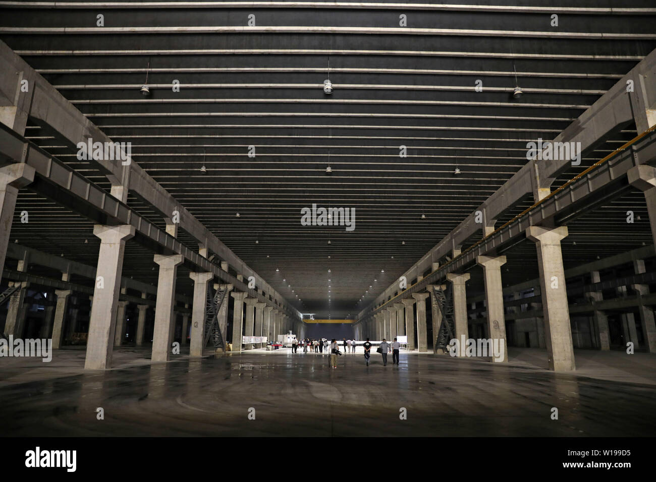 (190701) -- DALIAN, July 1, 2019 (Xinhua) -- Photo taken on June 25, 2019 shows the underground factory of Dalian Gona Technology Group Co., Ltd. in Dalian, northeast China's Liaoning Province. The 2019 Summer Davos Forum is held from July 1-3 in northeast China's coastal city of Dalian. Established by the World Economic Forum in 2007, the forum is held annually in China, alternating between the two port cities of Dalian and Tianjin. Summer Davos helped Dalian reshape the landscape of regional economy and strengthen the port's trade with other markets. Dalian has become an international city a Stock Photo