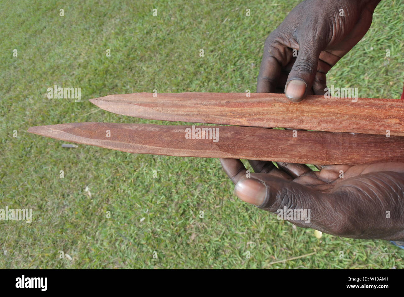 Australians aboriginal craftman a wooden Australian Aboriginal aboriginal weapons are for hunting as well as warfare Stock - Alamy