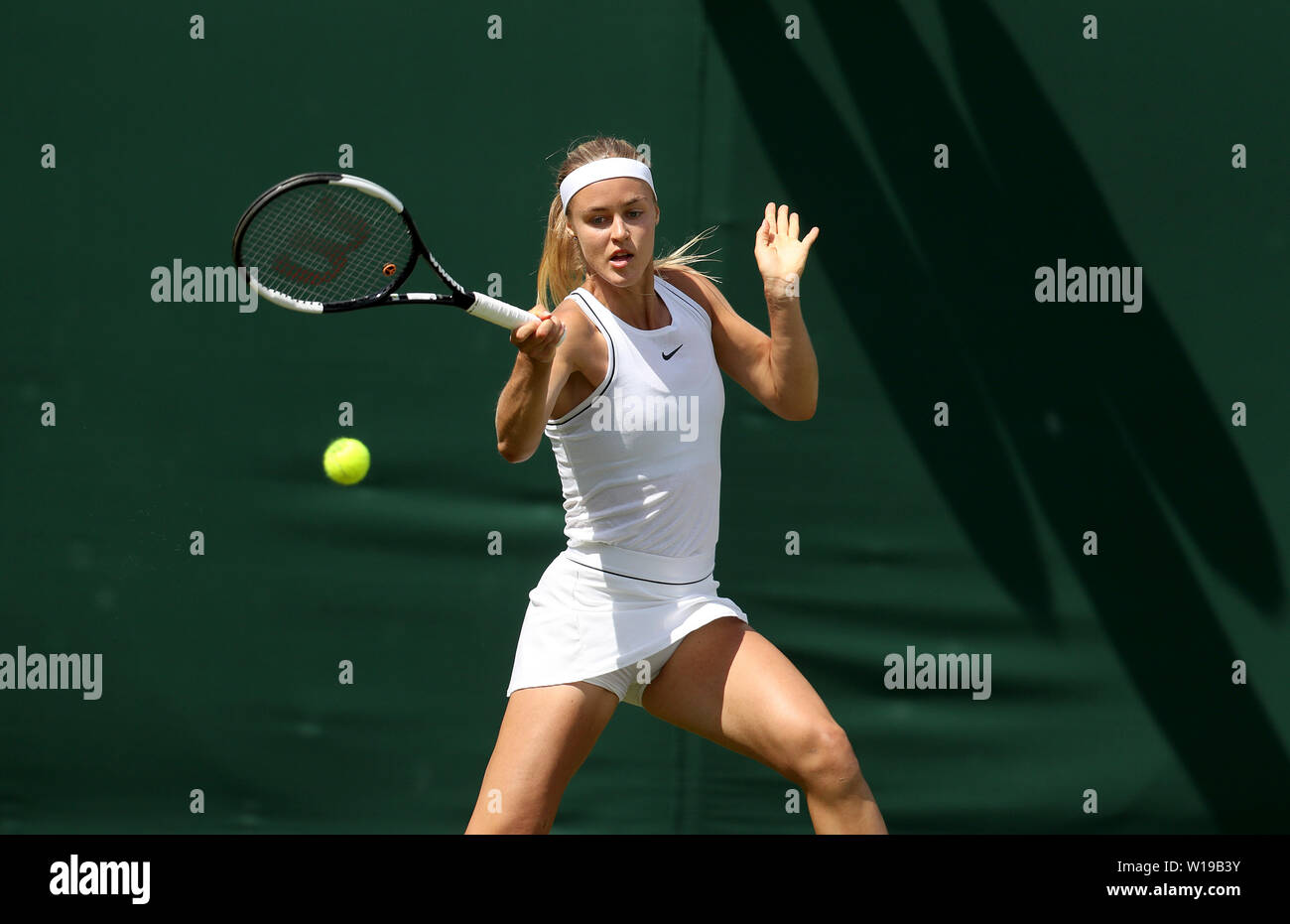 Anna Karolina Schmiedlova in action on day one of the Wimbledon  Championships at the All England Lawn Tennis and Croquet Club, London Stock  Photo - Alamy