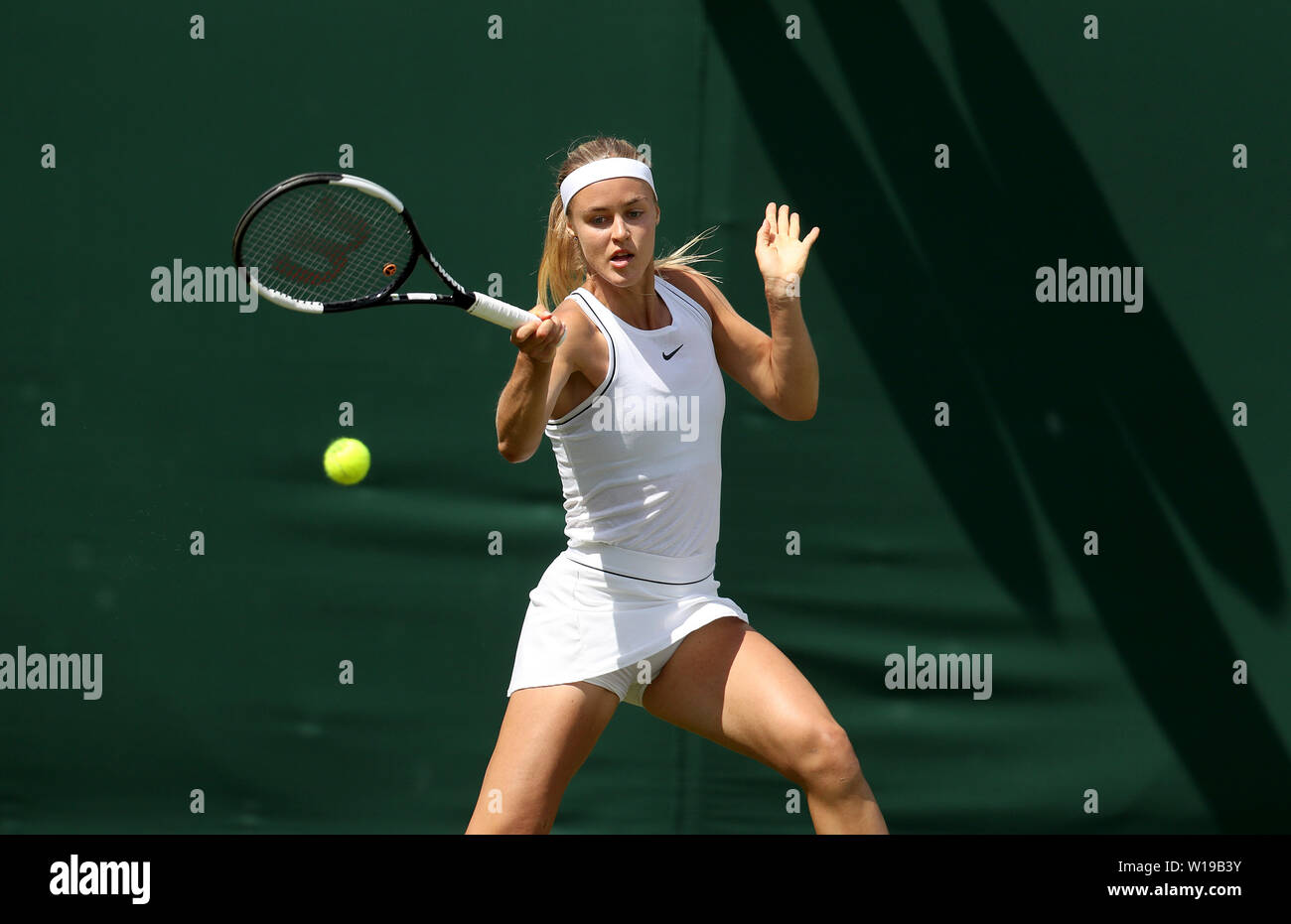 Anna Karolina Schmiedlova in action on day one of the Wimbledon