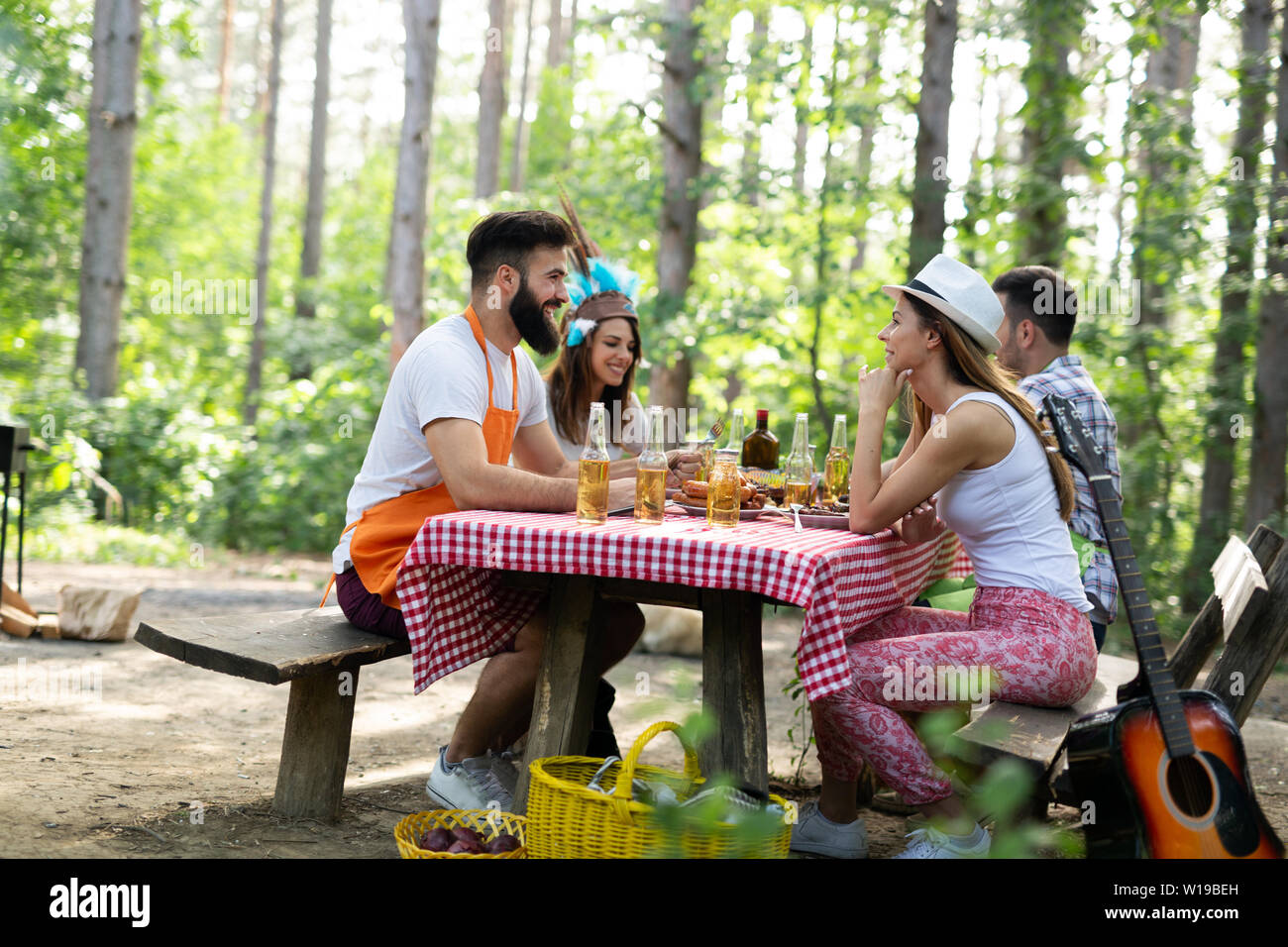 Group of friends having a barbecue party in nature Stock Photo - Alamy