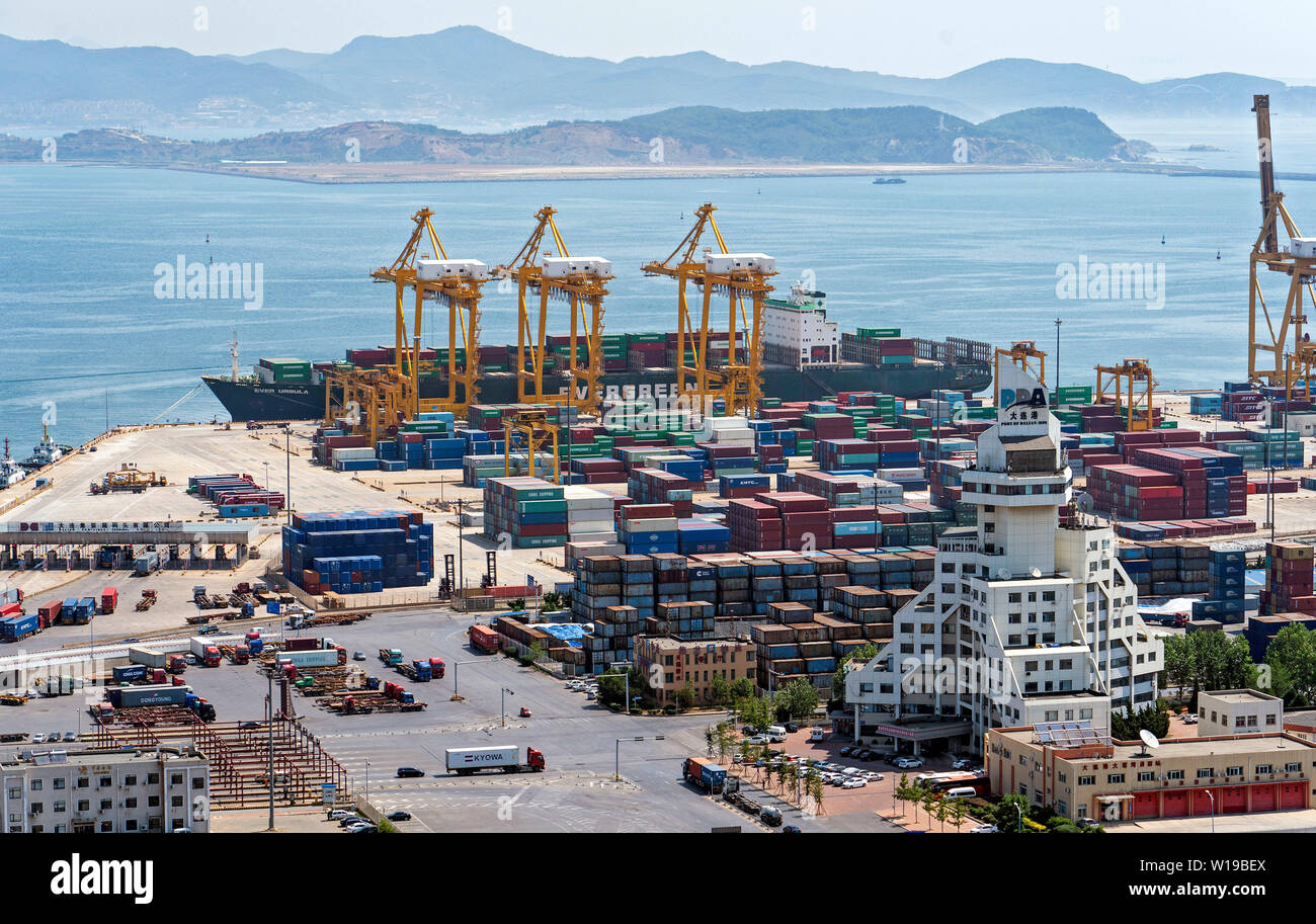 (190701) -- DALIAN, July 1, 2019 (Xinhua) -- Photo taken on June 24, 2019 shows the Dayaowan container terminal in Dalian, northeast China's Liaoning Province. The 2019 Summer Davos Forum is held from July 1-3 in northeast China's coastal city of Dalian. Established by the World Economic Forum in 2007, the forum is held annually in China, alternating between the two port cities of Dalian and Tianjin. Summer Davos has been reshaping the landscape of Dalian's regional economy and strengthening the port's trade with other markets. Dalian has become an international city and a showpiece of China's Stock Photo