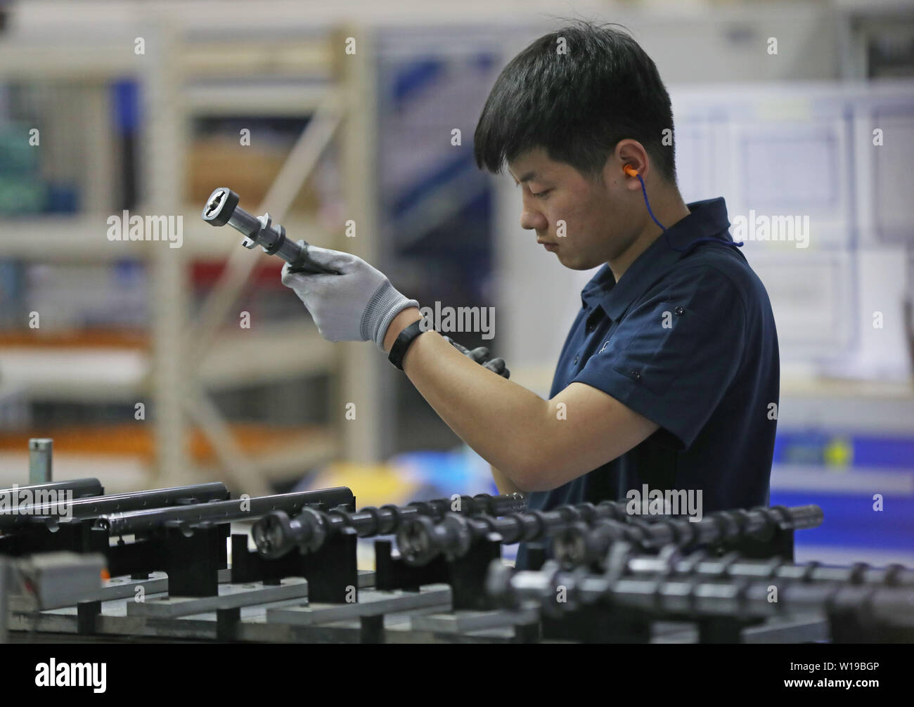 (190701) -- DALIAN, July 1, 2019 (Xinhua) -- A man works at ThyssenKrupp Presta Dalian Co., Ltd. in Dalian, northeast China's Liaoning Province, March 20, 2019. The 2019 Summer Davos Forum is held from July 1-3 in northeast China's coastal city of Dalian. Established by the World Economic Forum in 2007, the forum is held annually in China, alternating between the two port cities of Dalian and Tianjin. Summer Davos has been reshaping the landscape of Dalian's regional economy and strengthening the port's trade with other markets. Dalian has become an international city and a showpiece of China' Stock Photo
