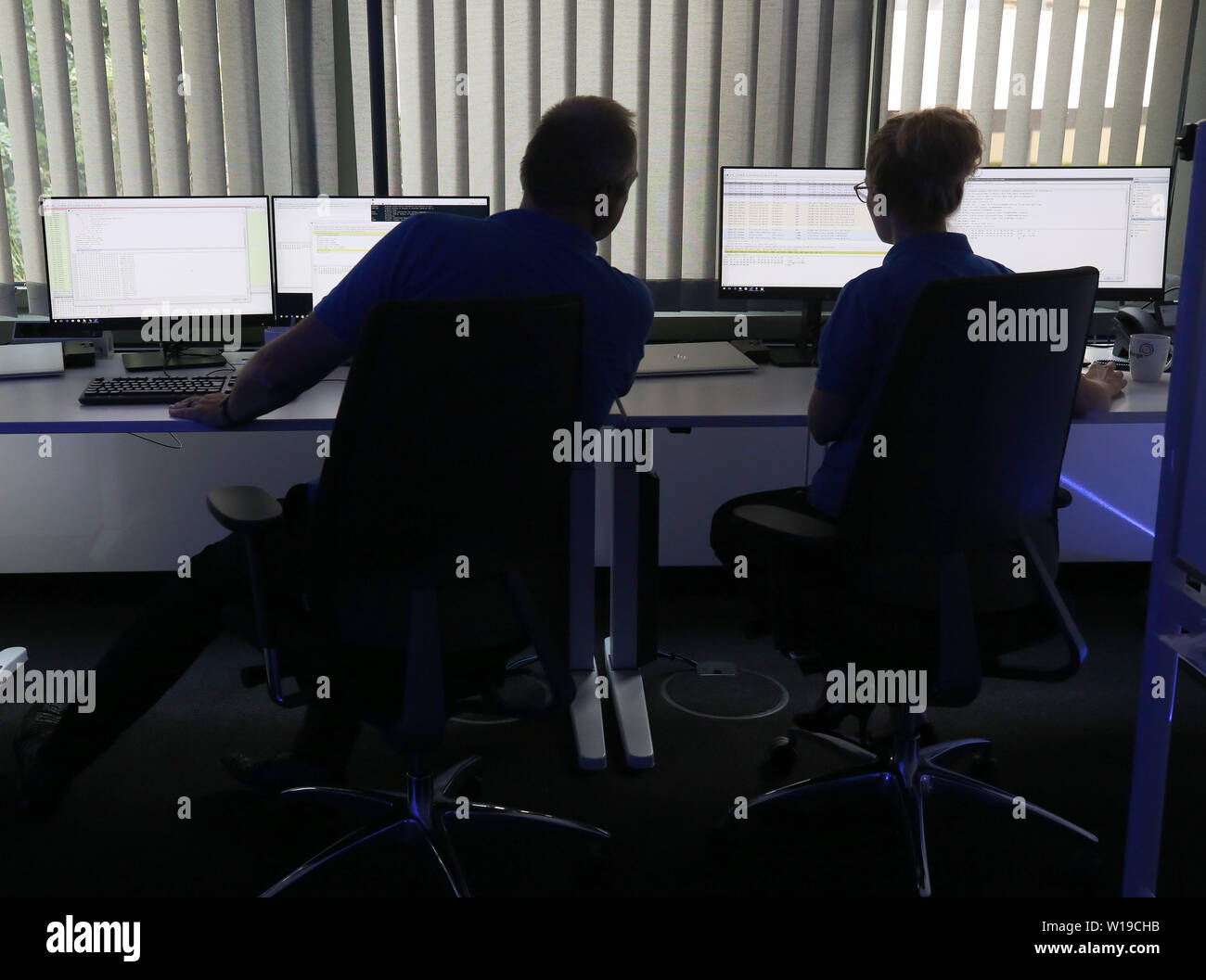 Essen, Germany. 01st July, 2019. In the 'Blue Room', Innogy employees practice defending the power grid against cyber attacks during a simulation. The energy company Innogy presents its training center for the defense against cyber attacks on power grids. Credit: Roland Weihrauch/dpa/Alamy Live News Stock Photo