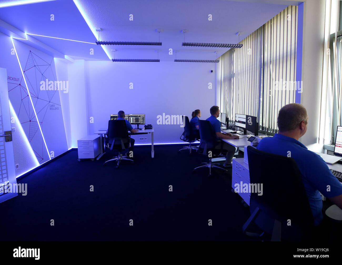 Essen, Germany. 01st July, 2019. In the 'Blue Room', Innogy employees practice defending against cyber attacks on the power grid during a simulation. The energy company Innogy presents its training center for the defense against cyber attacks on power grids. Credit: Roland Weihrauch/dpa/Alamy Live News Stock Photo
