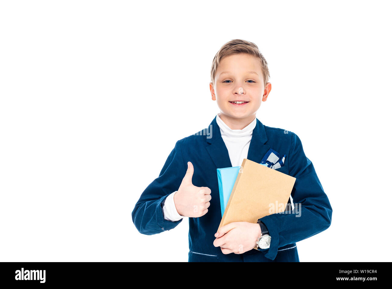 smiling schoolboy showing thumb up sign and holding books Isolated On ...