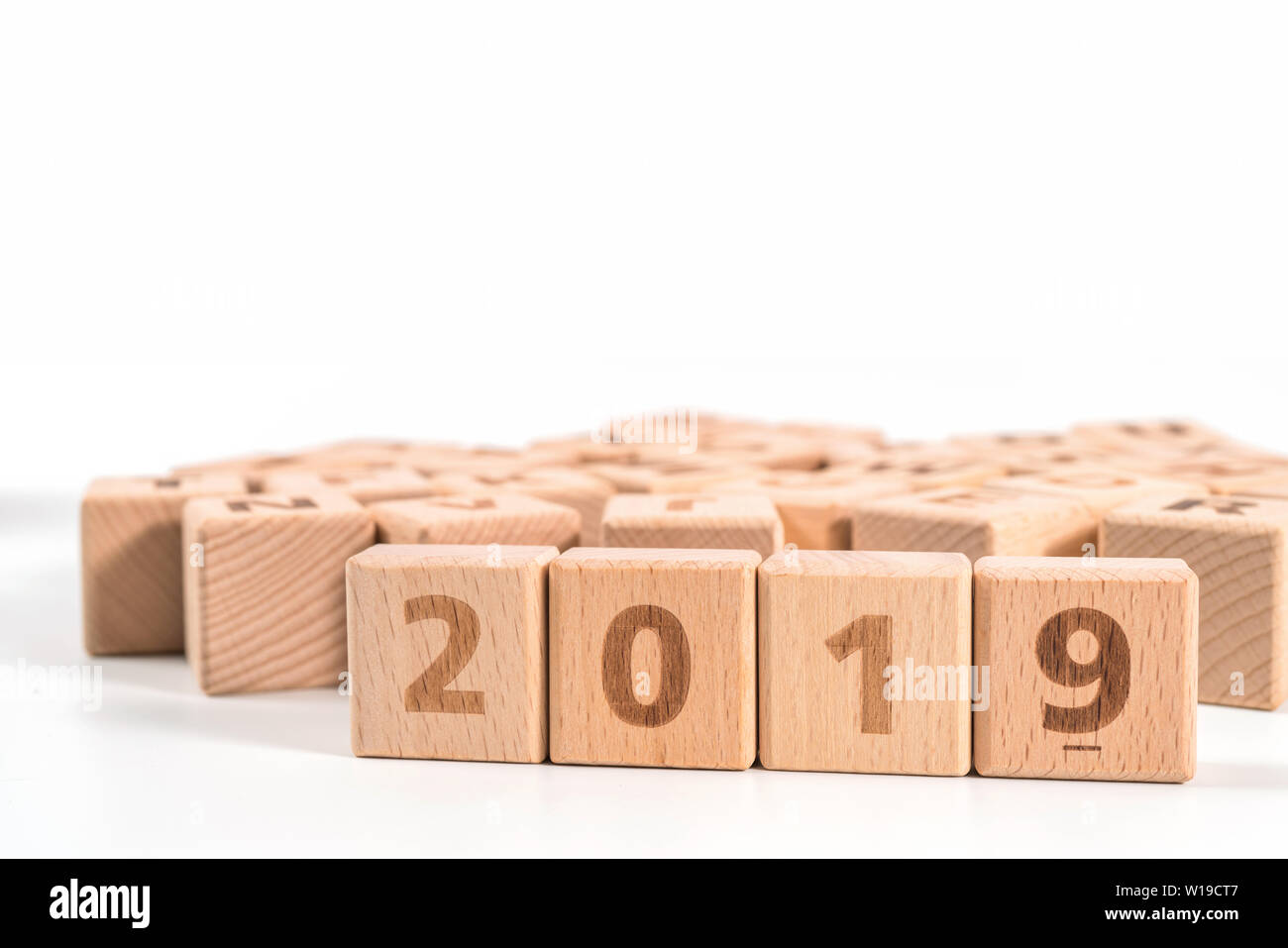 word 2019 on wood cube dices on white background. Stock Photo