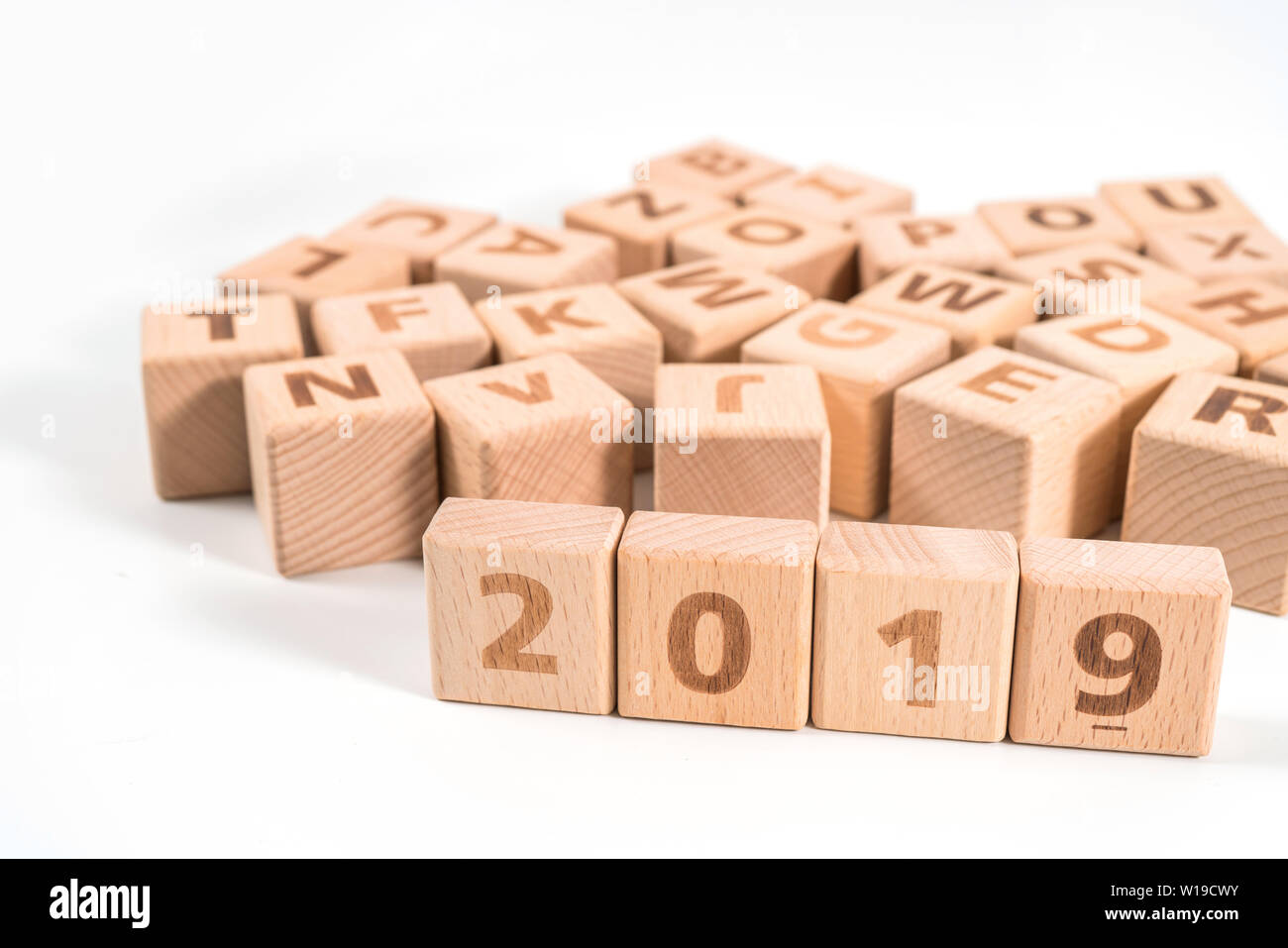 word 2019 on wood cube dices on white background. Stock Photo
