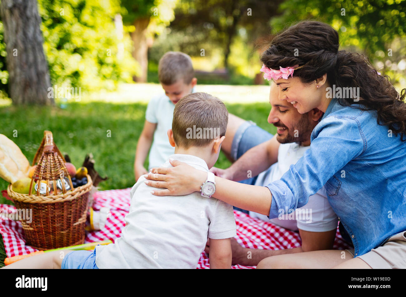 Young family with children having fun in nature Stock Photo
