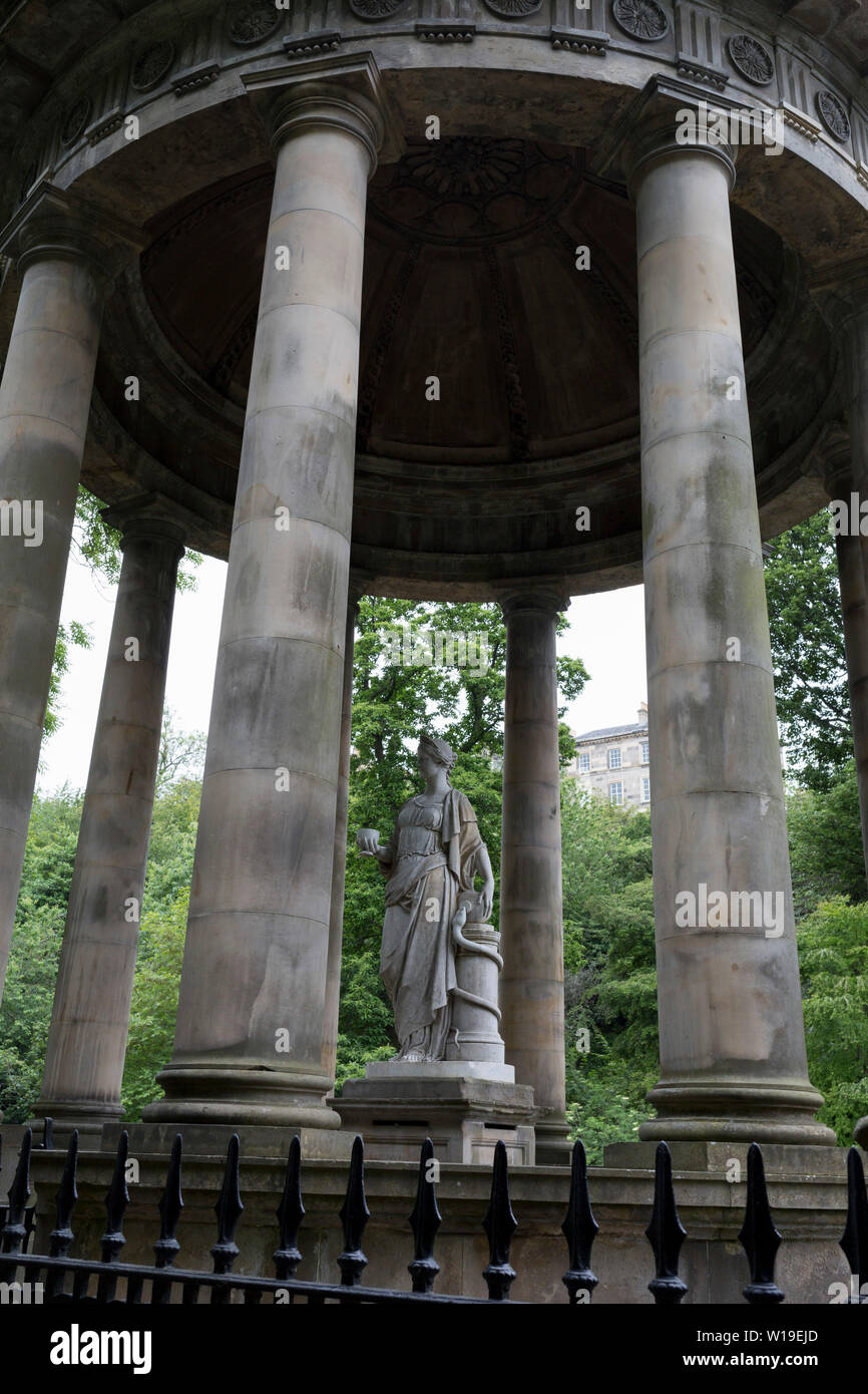 The circular neo-Roman St. Bernard's Mineral Well on the Water of Leith near Dean Village, on 26th June 2019, in Edinburgh, Scotland. The St Bernard's Well as we have it today was constructed in 1789 to a design by celebrated Edinburgh landscape painter Alexander Nasymth drawing inspiration from the Temple of Vesta at Tivoli in Italy. At the centre of an open pillared dome stands a marble statue of Hygieia, Goddess of Health. Stock Photo