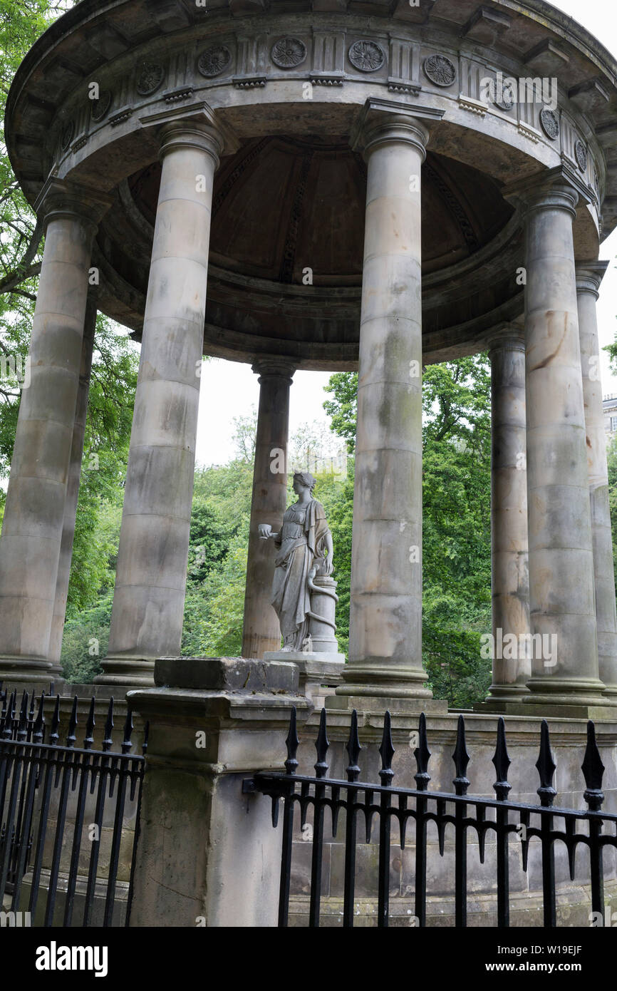 The circular neo-Roman St. Bernard's Mineral Well on the Water of Leith near Dean Village, on 26th June 2019, in Edinburgh, Scotland. The St Bernard's Well as we have it today was constructed in 1789 to a design by celebrated Edinburgh landscape painter Alexander Nasymth drawing inspiration from the Temple of Vesta at Tivoli in Italy. At the centre of an open pillared dome stands a marble statue of Hygieia, Goddess of Health. Stock Photo