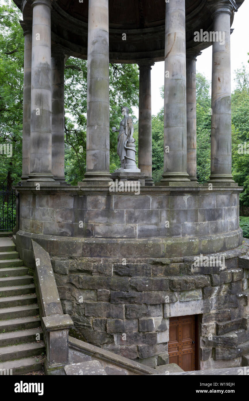 The circular neo-Roman St. Bernard's Mineral Well on the Water of Leith near Dean Village, on 26th June 2019, in Edinburgh, Scotland. The St Bernard's Well as we have it today was constructed in 1789 to a design by celebrated Edinburgh landscape painter Alexander Nasymth drawing inspiration from the Temple of Vesta at Tivoli in Italy. At the centre of an open pillared dome stands a marble statue of Hygieia, Goddess of Health. Stock Photo