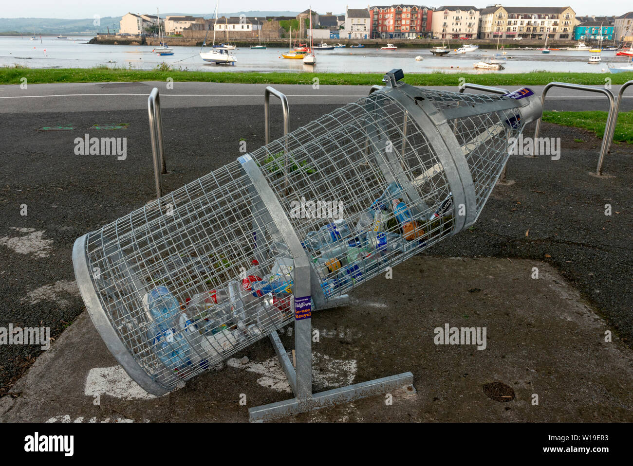 Bottle-shaped recycling bin for plastics at the harbor in Dungarvan, County Waterford, Ireland. Stock Photo