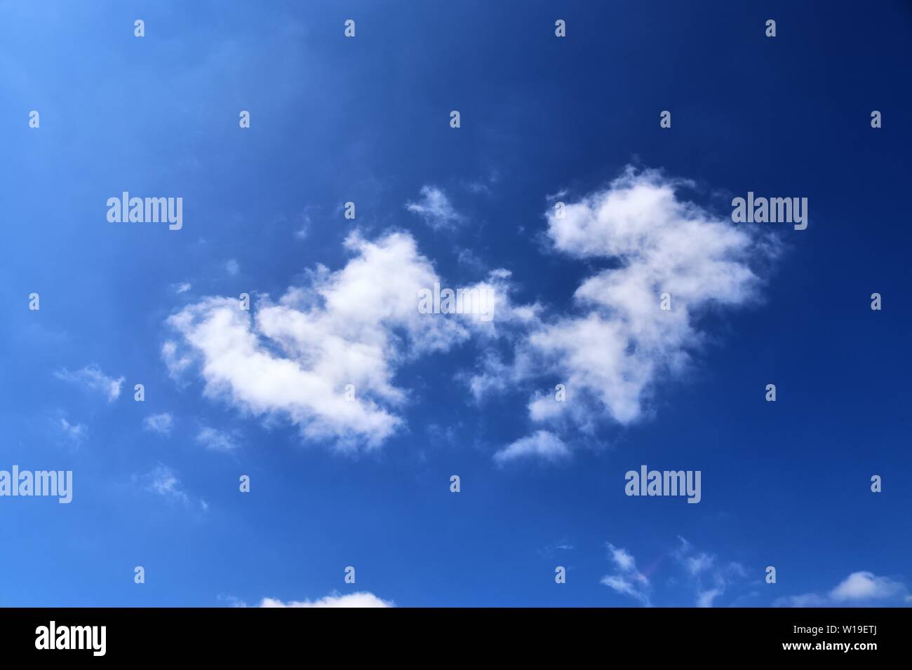 Beautiful fluffy white clouds in a deep blue sky on a summer day Stock ...