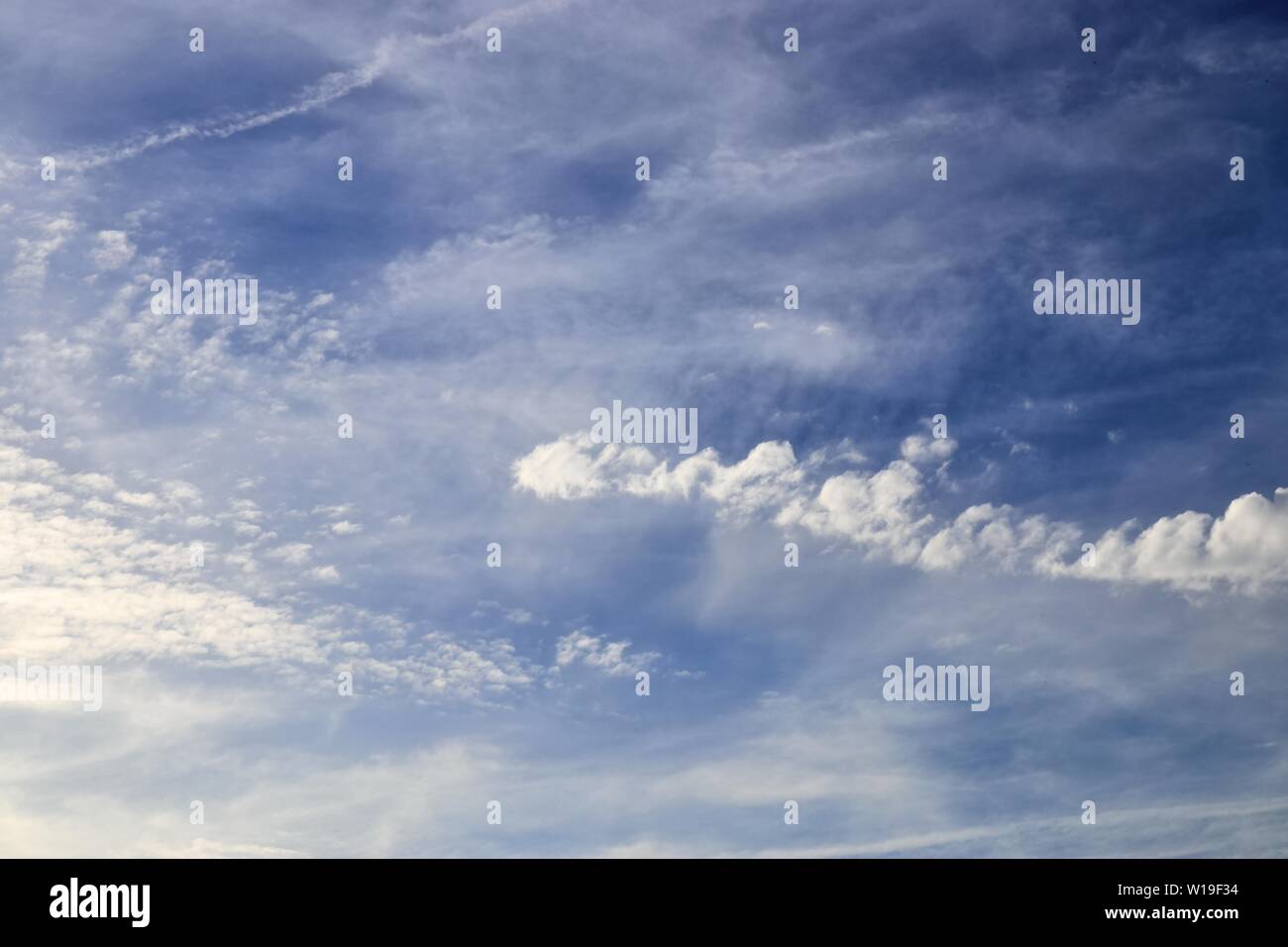 Beautiful fluffy white clouds in a deep blue sky on a summer day Stock ...