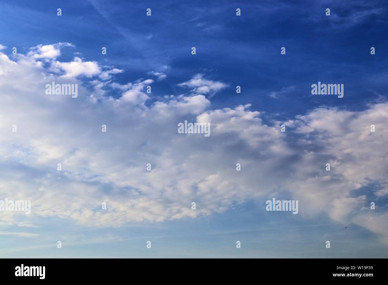 Beautiful fluffy white clouds in a deep blue sky on a summer day Stock ...