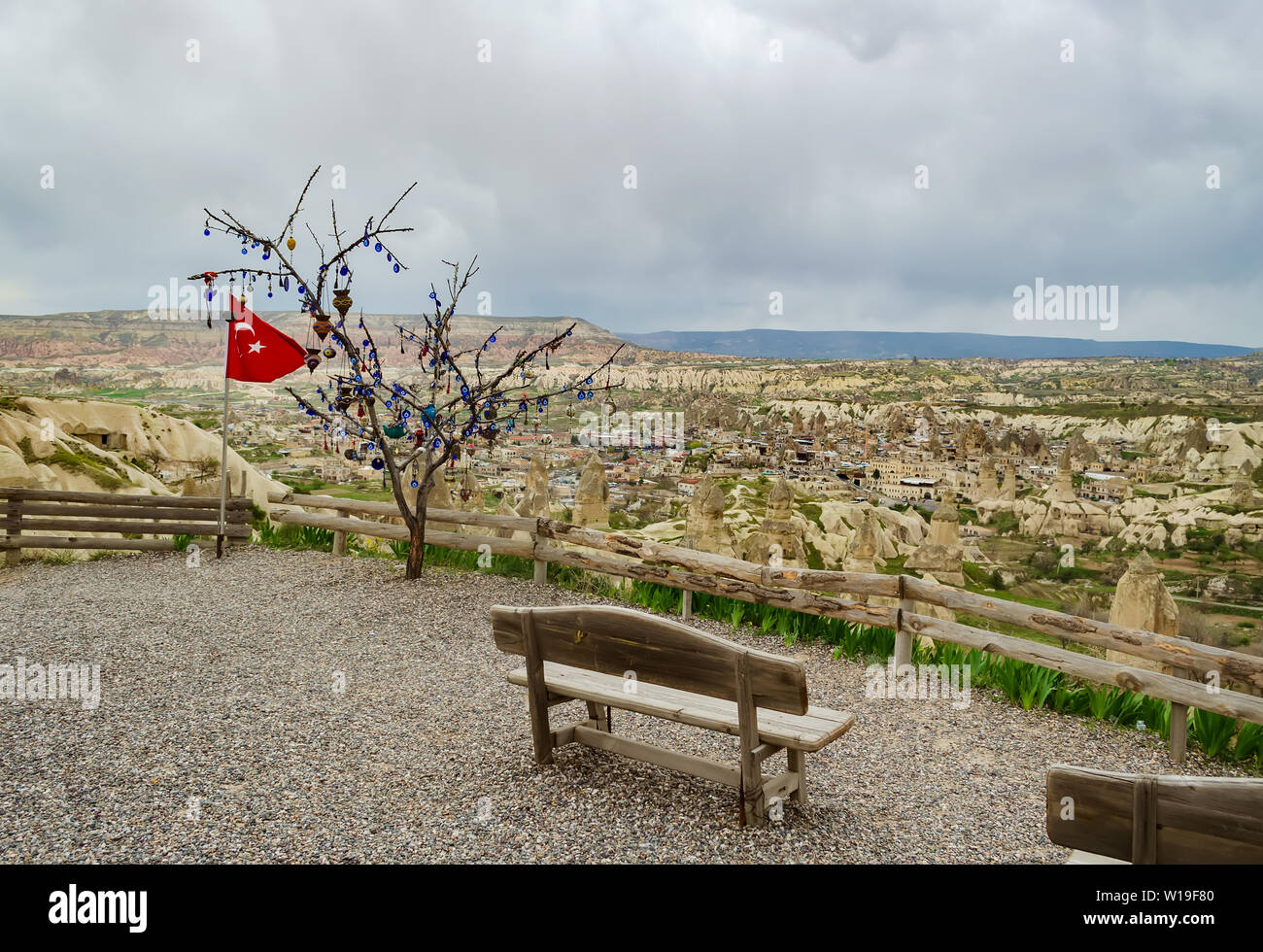 Turkish flag next to the wish tree on a viewing platform with bench in Nevsehir, Cappadocia Stock Photo