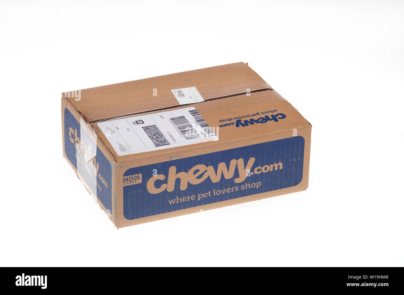 Chewy pet supplies box delivered via FedEx Home delivery on white background Stock Photo