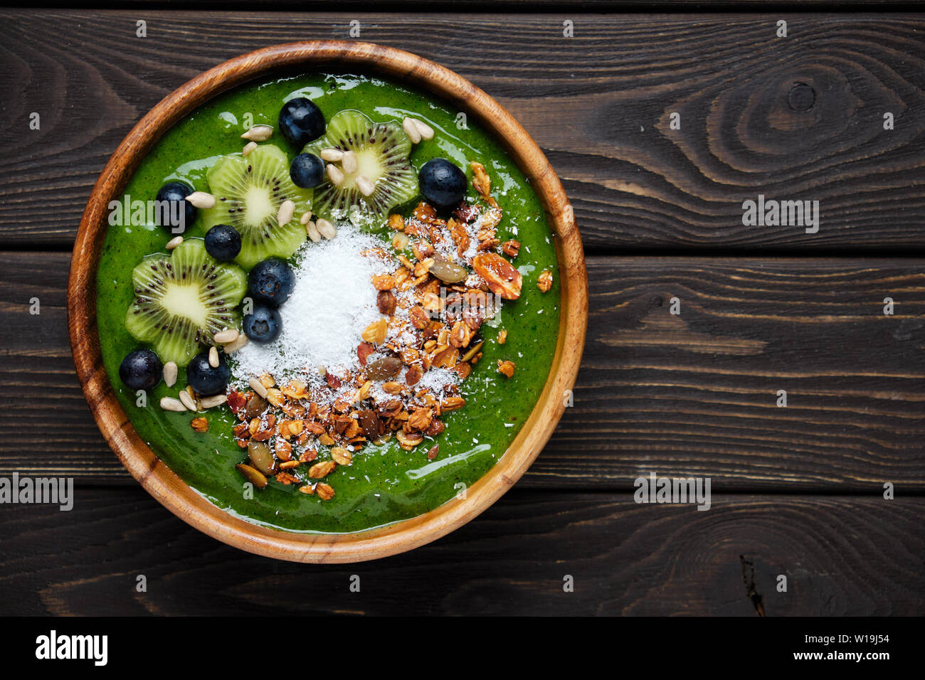 Smoothie bowls. Healthy breakfast bowl with chia seeds, muesli, berries, fruits and coconut