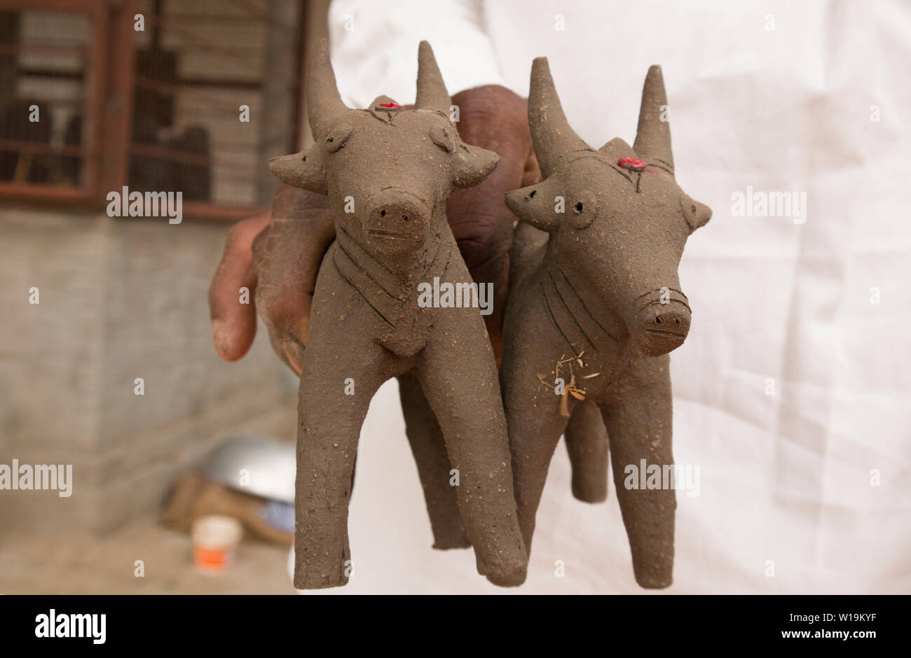 Bullocks made with mud clay, made during the festival at the start of the Monsoon in North Karnataka Stock Photo