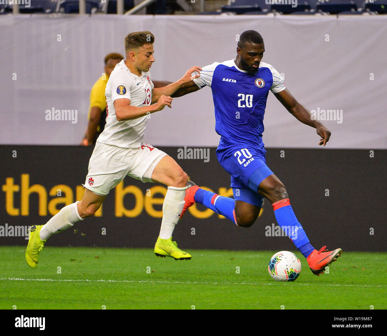 June 29, 2019: Canada defender, Marcus Godindo (23), and Haiti forward, Frantzdy Pierrot (20), work for control of the ball during the 2019 CONCACAF Gold Cup, quarter final match between Haiti and Canada, at NRG Stadium in Houston, TX. Mandatory Credit: Kevin Langley/Sports South Media/CSM Stock Photo